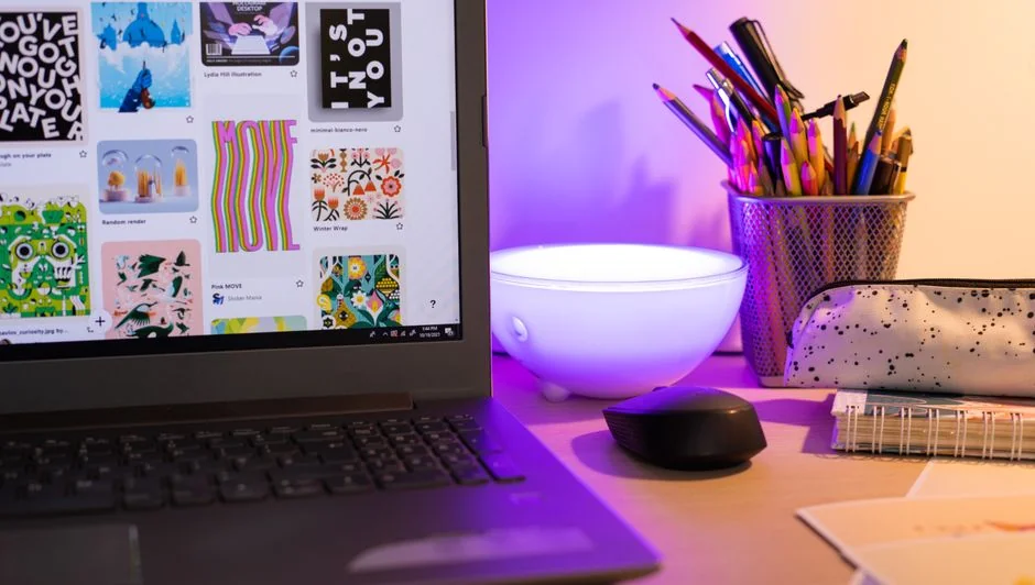A sleek office desk setup featuring Apple devices: iMac, MacBook, and iPad.